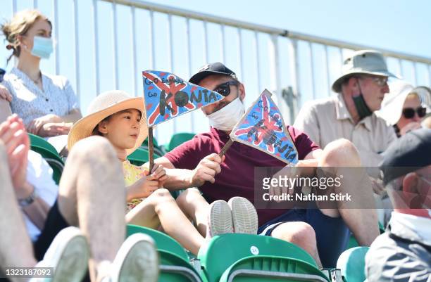 Young girl holds a 'Go Konta' sign while she watches the Johanna Konta of Great Britain play Nina Stojanovic during the Viking Open women's...
