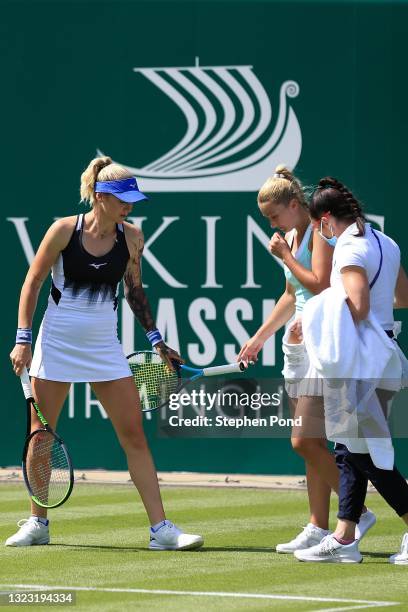 Dalila Jakupovic of Slovakia is helped up by Tereza Martincova of Czech Republic after slipping in qualifying during the Viking Classic Birmingham at...