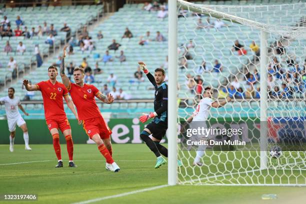 Chris Mepham, Joe Rodon and Danny Ward of Wales appeal for a goal scored by Mario Gavranovic of Switzerland to be disallowed during the UEFA Euro...