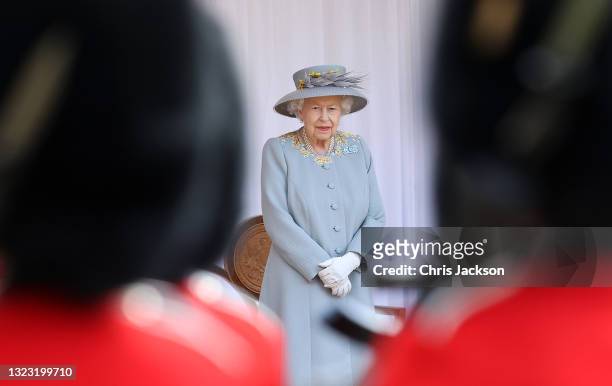 Queen Elizabeth II attends a military ceremony in the Quadrangle of Windsor Castle to mark her Official Birthday on June 12, 2021 at Windsor Castle...
