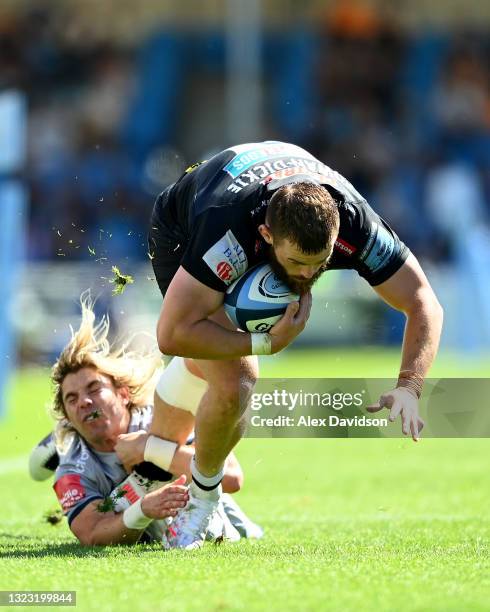 Luke Cowan-Dickie of Exeter Chiefs is tackled by Faf de Klerk of Sale Sharks during the Gallagher Premiership Rugby match between Exeter Chiefs and...