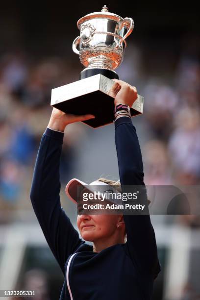 Match Winner Barbora Krejcikova of Czech Republic lifts the Winners Trophy after the Women’s final on day fourteen of the 2021 French Open at Roland...