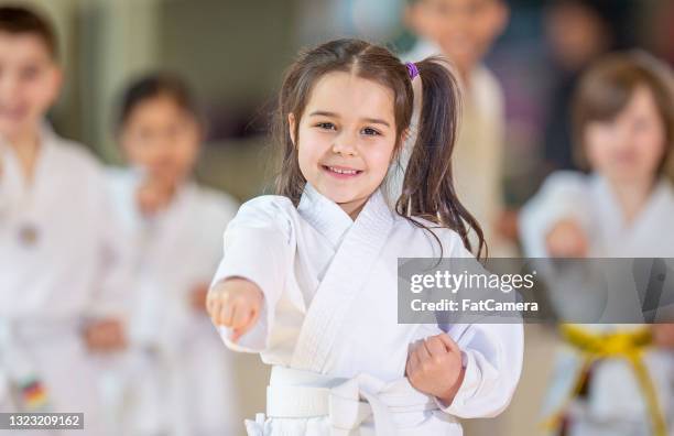 young karate class - girl martial arts stock pictures, royalty-free photos & images