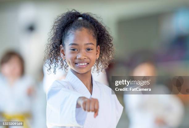 young karate class - kids martial arts stock pictures, royalty-free photos & images