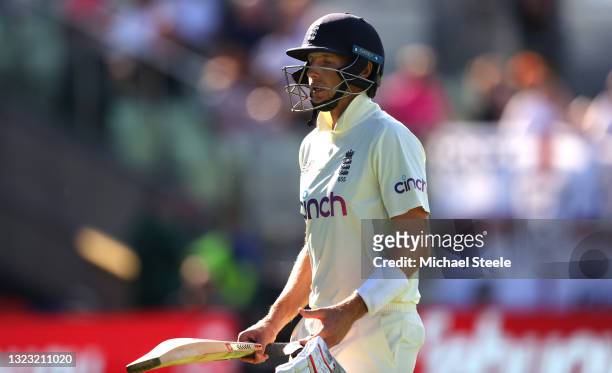 England captain Joe Root leaves the field after being caught behind by Wicketkeeper Tom Blundell off the bowling of Ajaz Patel for 11 runs during day...