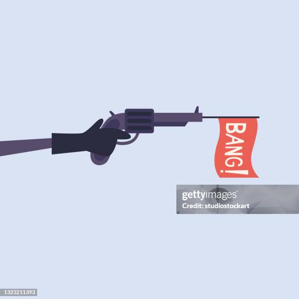 male hand holding revolver with bang flag - gunman stock illustrations