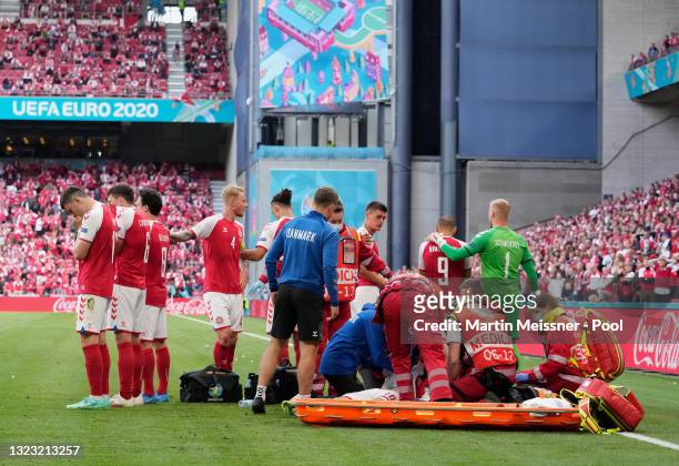 Christian Eriksen of Denmark receives medical treatment during the UEFA Euro 2020 Championship Group B match between Denmark and Finland on June 12,...