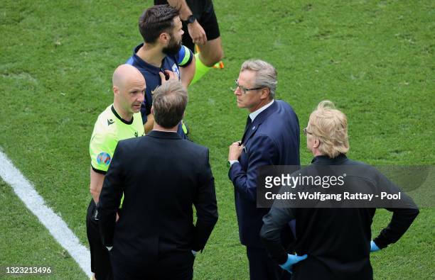 Match Referee, Anthony Taylor interacts with Kasper Hjulmand, Head Coach of Denmark and Markku Kanerva, Head Coach of Finland during the UEFA Euro...