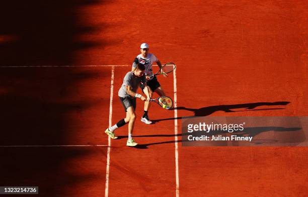 Alexander Bublik of Kazakhstan plays a shot ahead of teammate Andrey Golubev during the Men's Doubles Final on day fourteen of the 2021 French Open...