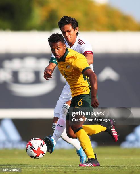José Juan Macías Guzmán of Mexico competes for the ball with Tyrese Francois of Australia during a International Friendly match between Mexico and...
