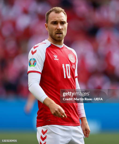 Christian Eriksen of Denmark looks on during the UEFA Euro 2020 Championship Group B match between Denmark and Finland on June 12, 2021 in...