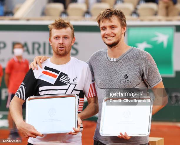 Runners up Alexander Bublik and Andrey Golubev of Kazakhstan pose with their Trophy after the Men's Double's Final on day fourteen of the 2021 French...