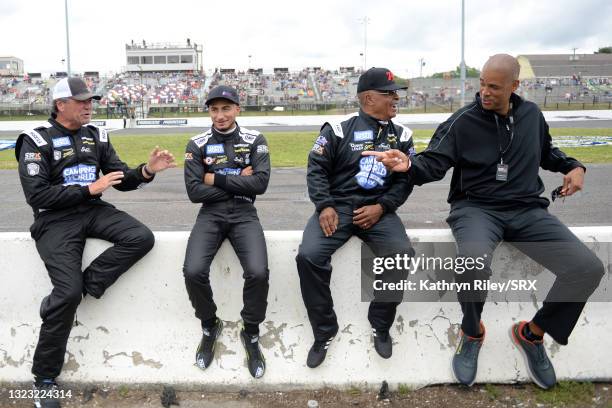 Michael Waltrip, Ernie Francis Jr., Willy T. Ribbs and CBS host Brad Daugherty talk on the grid during practice for the Inaugural Superstar Racing...