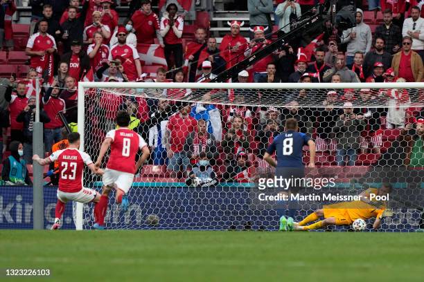 Lukas Hradecky of Finland saves a penalty taken by Pierre-Emile Hojbjerg of Denmark during the UEFA Euro 2020 Championship Group B match between...