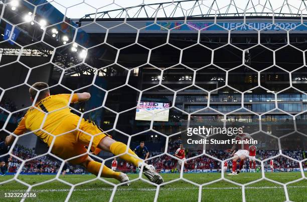 Lukas Hradecky of Finland saves a penalty from Pierre-Emile Hojbjerg of Denmark during the UEFA Euro 2020 Championship Group B match between Denmark...