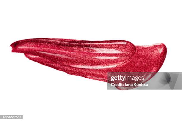 red glitter lipstick mark on white background isolated. lip gloss, nail polish smear. products for makeup and skin care. beauty cosmetics. cosmetology. closeup. - pink lips fotografías e imágenes de stock