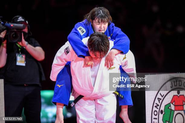 Sarah Asahina of Japan carries Wakaba Tomita of Japan on her back during the final match of the World Judo Championships Hungary 2021 at Papp Laszlo...