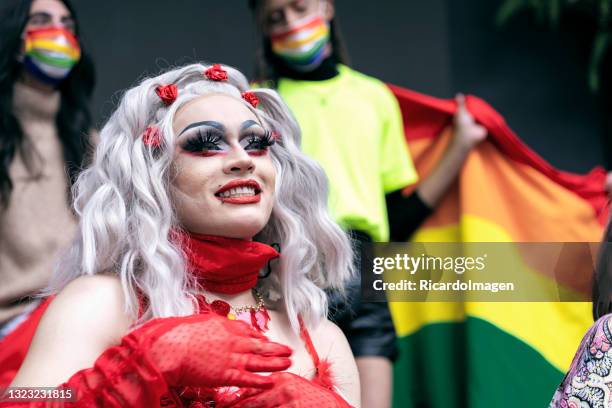 drag queen smiles as she enjoys her day celebrating gay pride with all her friends. - drag queens stock pictures, royalty-free photos & images