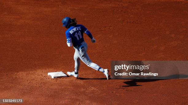 Bo Bichette of the Toronto Blue Jays rounds second base after hitting a solo home run at the top of the fifth inning of the game against the Boston...