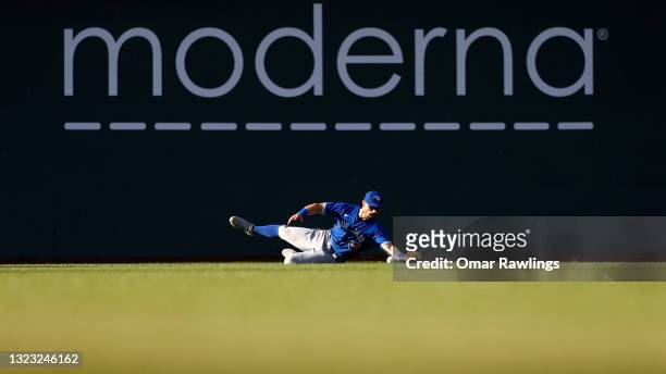 Randal Grichuk of the Toronto Blue Jays drops a line drive in the bottom of the sixth inning of the game against the Boston Red Sox at Fenway Park on...