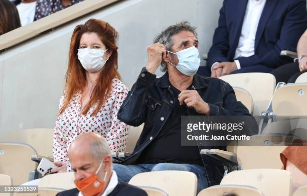 Julien Clerc and his wife Helene Gremillon attend day 13 of the 2021 Roland-Garros, French Open, a Grand Slam tennis tournament at Roland-Garros...