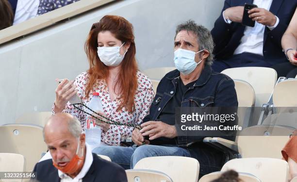 Julien Clerc and his wife Helene Gremillon attend day 13 of the 2021 Roland-Garros, French Open, a Grand Slam tennis tournament at Roland-Garros...