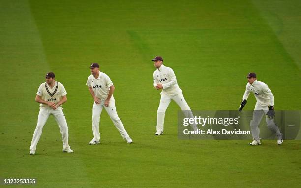 Jamie Overton, Rikki Clarke, Will Jacks and Jamie Smith of Surrey watch on during Day Two of the LV= Insurance County Championship match between...