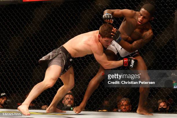 Movsar Evloev of Russia fights Hakeem Dawodu of Canada during their UFC 263 featherweight match at Gila River Arena on June 12, 2021 in Glendale,...