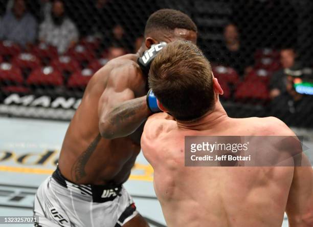 Hakeem Dawodu of Canada punches Movsar Evloev of Russia in their featherweight fight during the UFC 263 event at Gila River Arena on June 12, 2021 in...
