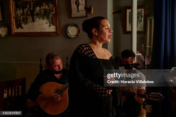 Fado singer Salome Machado performs at Bohemia restaurant in Alfama historical neighborhood during COVID-19 Coronavirus pandemic on June 12, 2021 in...