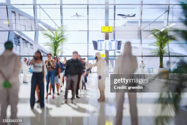 airport security checkpoint with people standing in line - airport tsa stock pictures, royalty-free photos & images