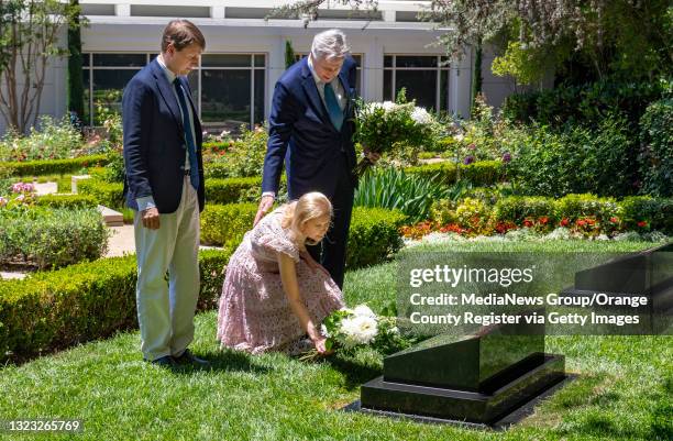 Christopher Nixon Cox, left, stands with his father, Edward Cox, right, as his mother Patricia Nixon Cox, daughter of the 37th United States...