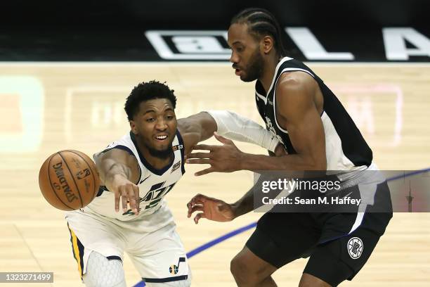 Donovan Mitchell of the Utah Jazz passes as Kawhi Leonard of the LA Clippers defends during the second half of a game at Staples Center on June 12,...