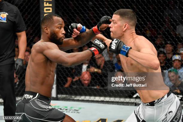 Nate Diaz and Leon Edwards of Jamaica trade punches in their welterweight fight during the UFC 263 event at Gila River Arena on June 12, 2021 in...
