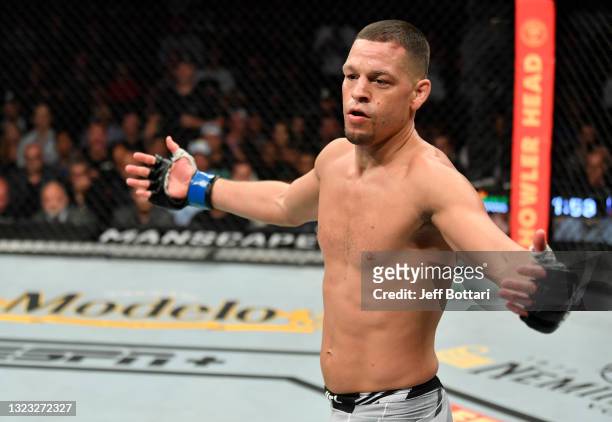 Nate Diaz taunts Leon Edwards of Jamaica in their welterweight fight during the UFC 263 event at Gila River Arena on June 12, 2021 in Glendale,...