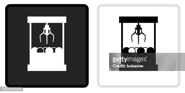 toy grabber icon on  black button with white rollover - claw machine stock illustrations