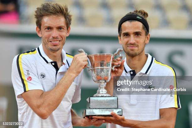 Winners Nicolas Mahut and Pierre-Hughes Herbert of France during the Men's Doubles final trophy ceremony on day 14 of the French Open 2021, Grand...