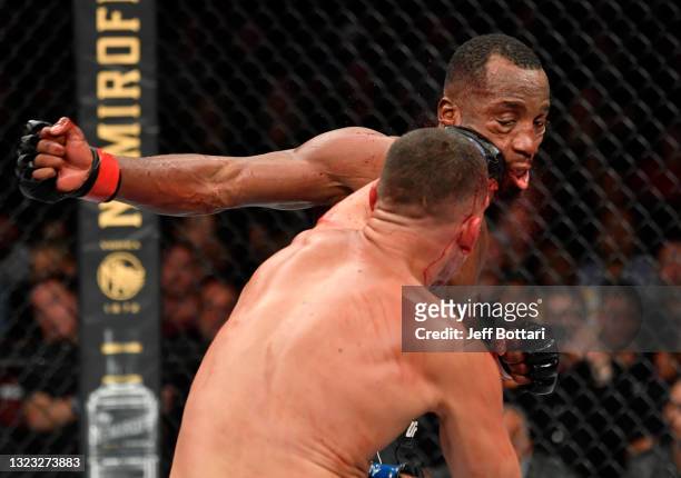 Nate Diaz punches Leon Edwards of Jamaica in their welterweight fight during the UFC 263 event at Gila River Arena on June 12, 2021 in Glendale,...