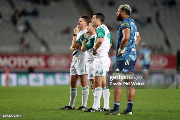 Patrick Tuipulotu of the Blues looks on as referee Ben O'Keeffe watches a replay during the round five Super Rugby Trans-Tasman match between the...