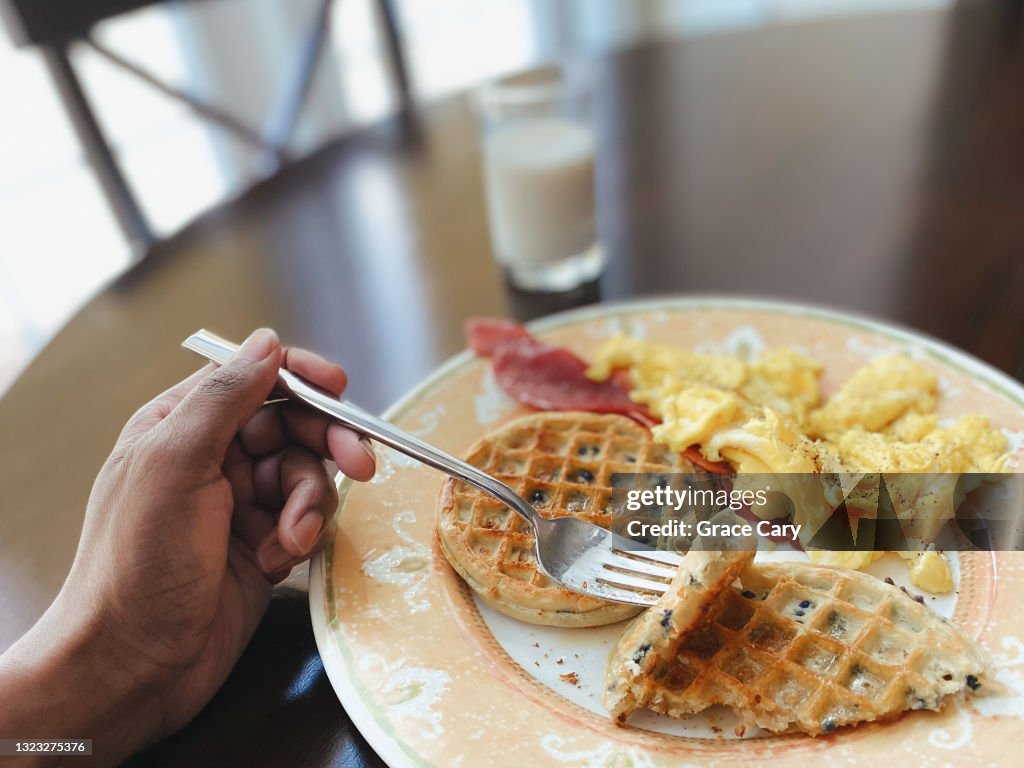 Woman Eats Breakfast