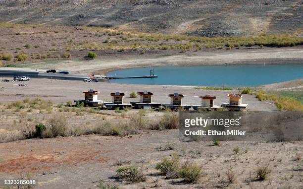 Restrooms that used to float in various areas of Lake Mead are stored on pontoon floats in the dirt in Boulder Harbor where the Lake Mead Marina was...