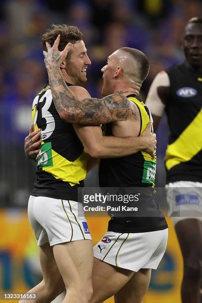 Kane Lambert and Dustin Martin of the Tigers celebrates a goal during the round 14 AFL match between the West Coast Eagles and the Richmond Tigers at...