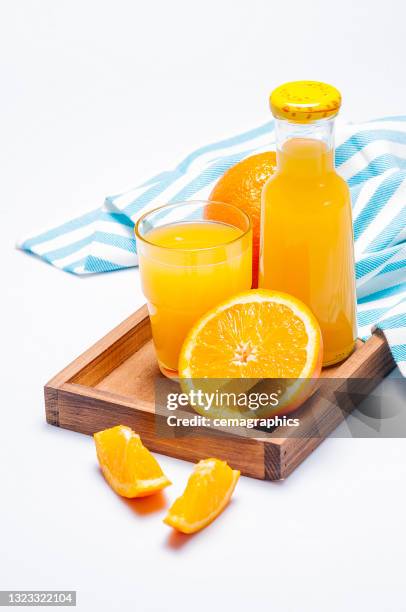 fresh squeezed orange fruit juice in a bottle - orange juice stock pictures, royalty-free photos & images