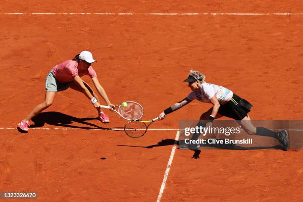 Bethanie Mattek-Sands of The United States, playing partner of Iga Swiatek of Poland stretches to play a forehand in their Women's Doubles Final...