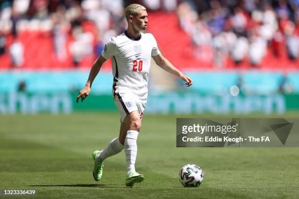 Phil Foden of England runs with the ball during the UEFA Euro 2020 Championship Group D match between England and Croatia at Wembley Stadium on June...