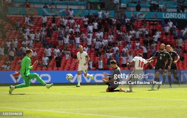 Raheem Sterling of England scores their side's first goal past Dominik Livakovic of Croatia during the UEFA Euro 2020 Championship Group D match...