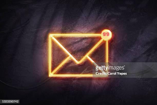 yellow envelope with notification-email concept in neon bright lights - neon speech bubble stock pictures, royalty-free photos & images