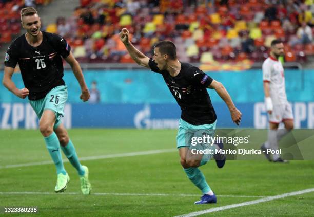 Stefan Lainer of Austria celebrates with Sasa Kalajdzic after scoring their side's first goal during the UEFA Euro 2020 Championship Group C match...