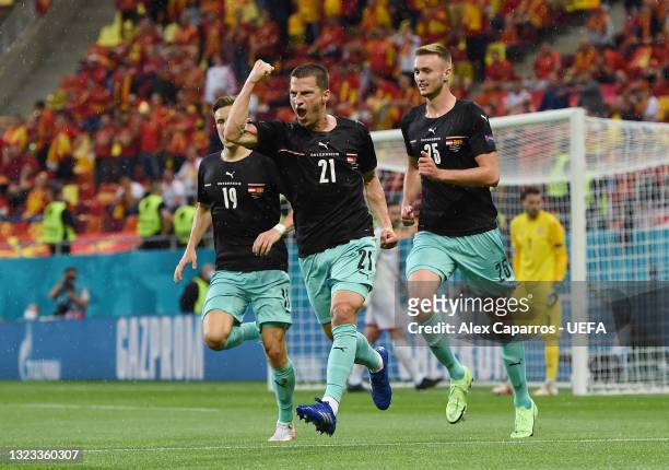 Stefan Lainer of Austria celebrates after scoring their side's first goal during the UEFA Euro 2020 Championship Group C match between Austria and...