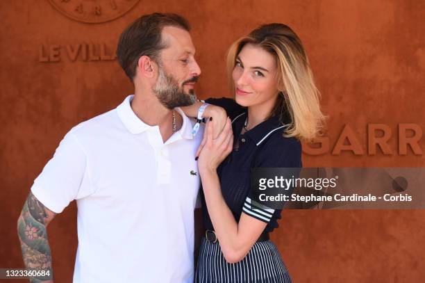 Nicolas Duvauchelle and Chloé Roy attend the French Open 2021at Roland Garros on June 13, 2021 in Paris, France.